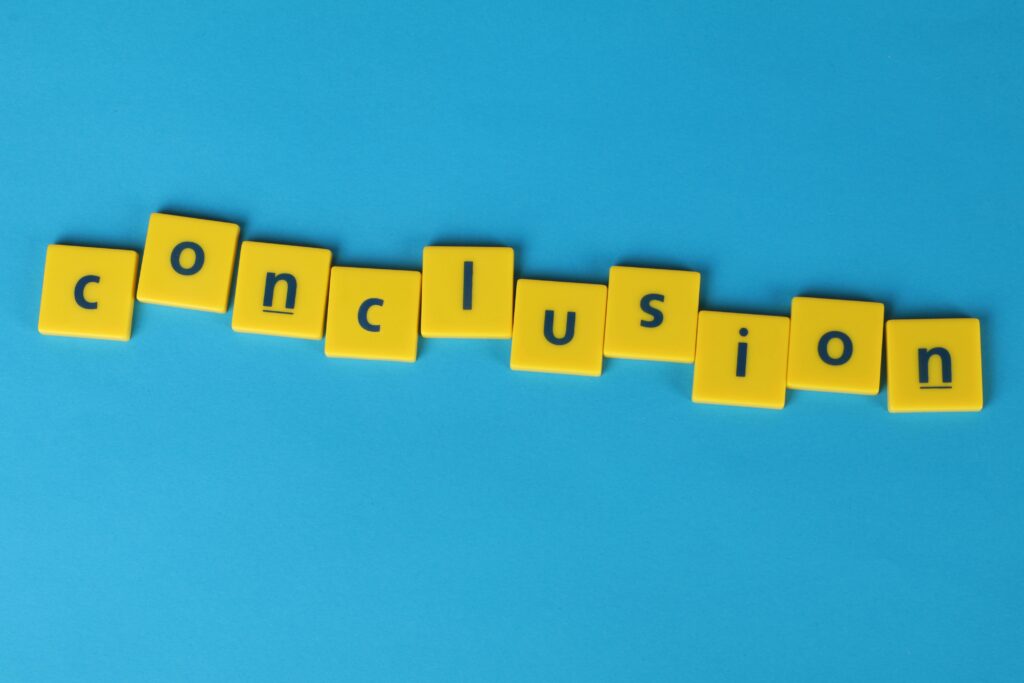 Yellow letter tiles spelling 'conclusion' on a vibrant blue background emphasizing creativity and achievement.